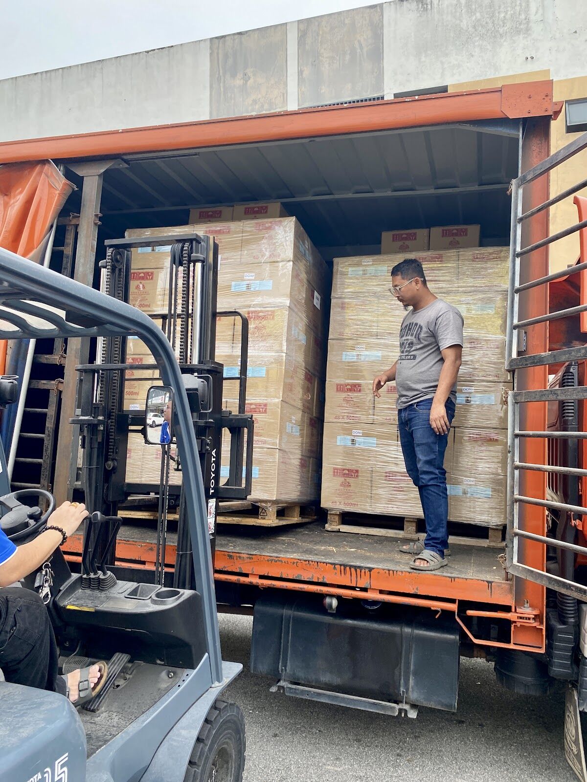 Forklift loading cartons of Jecall products onto a lorry for dispatch